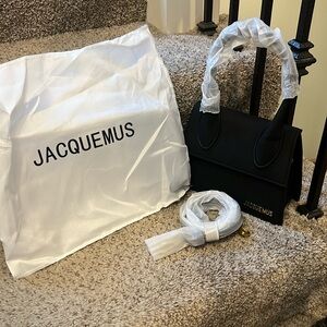 Black Jacquemus suede bag.